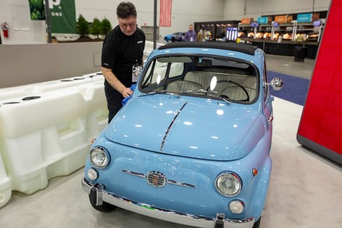 Detroit, Michigan USA - 15 January 2026 - A worker polishes a 1962 Fiat 500 at the Detroit Auto