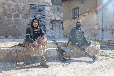 In Aleppo, Syria on January 10, 2026, Syrian Army soldiers deploy throughout the Sheikh Maqsoud and
