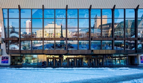 Gewandhaus façade with reflection of Augustusplatz in winter with snow, Leipzig, Saxony, Germany