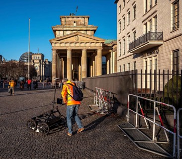 Measurement of the walkway at the Brandenburg Gate near the American Embassy, Berlin, Germany