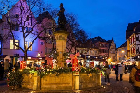 Colourfully illuminated and Christmassy decorated half-timbered houses, old town, blue hour,