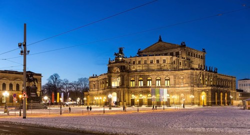 Illuminated Semper Opera House and Theatre Square with snow at dusk, Old Town of Dresden, Saxony,
