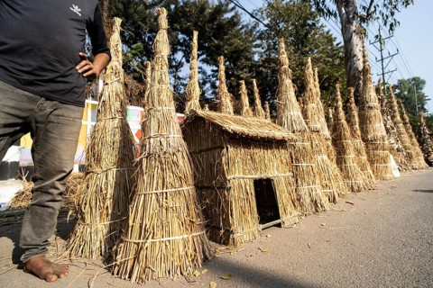 Vendor selling Meji (Bonfite), as part of preparations ahead of the 'Magh Bihu' festival, in