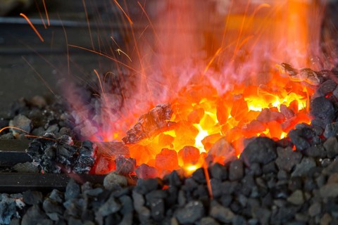 A blacksmith forging, working at the Ehnert forge in Dresden-Bühlau, Saxony, Germany