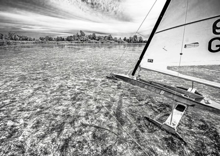 Ice sailors on water in black and white with strong contrast and structure, Dümmer nature park