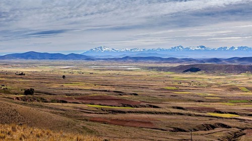 Wide plain with mountains and clouds on the horizon, The Altiplano landscape in the Andes of