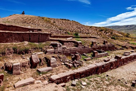 Historic ruins with terraces in rocky landscape under a clear sky, The archaeological site with the