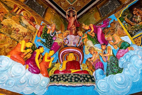 Buddha scene with figures standing in prayer surrounded by colorful frescoes and vivid colors, The