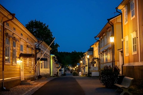 Street scene in the old town of Naantali at night with warmly lit houses, Naanatali,