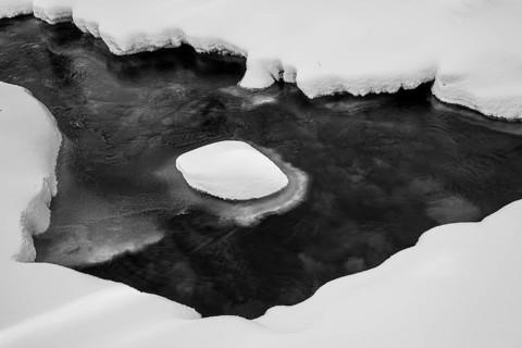 Ilsenburg, Saxony-Anhalt, Germany, snowy and icy Ilse river in the Harz National Park on