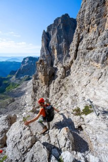 Climbers on the Via Ferrata Bocciere Centrale via ferrata, spectacular mountain landscape with