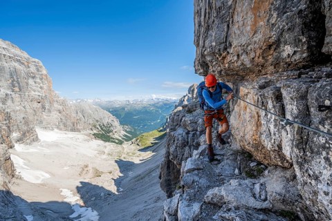 Mountaineers on a narrow band of rocks on the Via Ferrata Bocciere Centrale via ferrata,