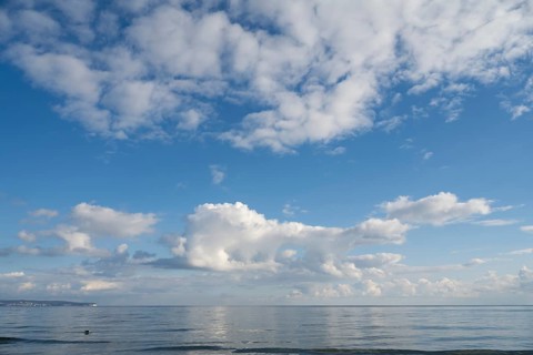 View across the Baltic Sea towards the chalk coast, sky with white clouds, Binz, seaside resort,
