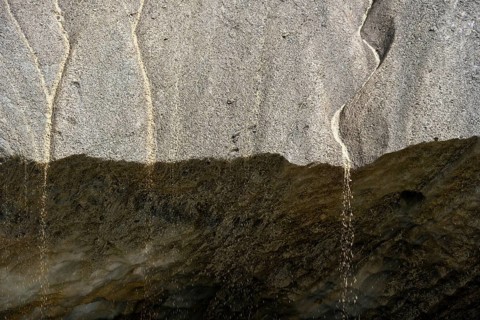 Meltwater at a glacier cave, underground glacier stream, Castner Glacier, Delta Range, Alaska