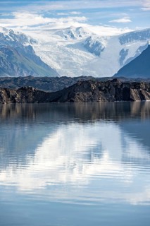 Mountain landscape reflected in glacial lake, Mount Blackburn and Kennicott Glacier, McCarthy Road,