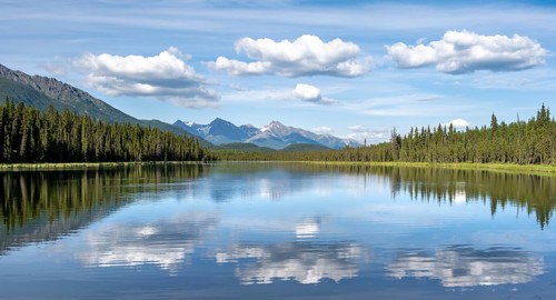 Mountains are reflected in idyllic Crystal Lake, McCarthy Highway, Wrangell St. Elias National