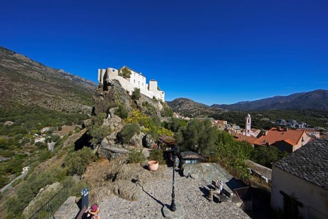 Citadel with the bastion Eagle's Nest, mountain town of Corte, on the right the village of Corte,