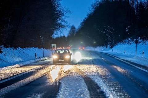 Country road with snow and slush Bergisches Land, near Marienheide, North Rhine-Westphalia, Germany