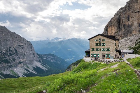 Rifugio Maria E Alberto Ai Brentai mountain hut and rocky peak, Brenta, Trentino, Italy