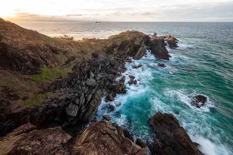 Sunset with wide view over the east coast at Cape Byron, New South Wales, Australia