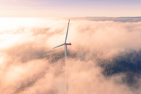 Wind turbine juts out of thick clouds, surrounded by foggy landscape, Bad Wildbad, Calw district,