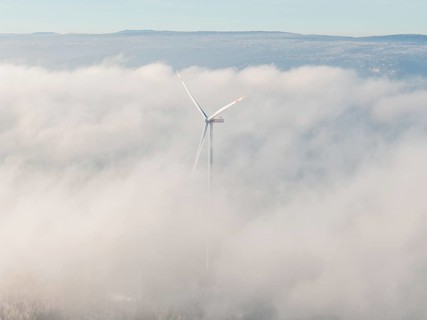 Blurred wind turbine hiding in thick clouds covered in fog, Bad Wildbad, Calw district, Black