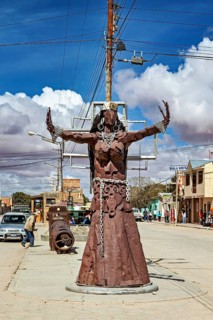 Metal sculpture on an urban street under a blue sky, The city of Uyuni in Bolivia