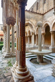 Famous Benedictine monastery cloister, decorated columns, double columns and fountains, Monreale