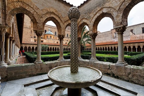 Famous Benedictine monastery cloister, decorated columns and fountains, Cathedral of Monreale,