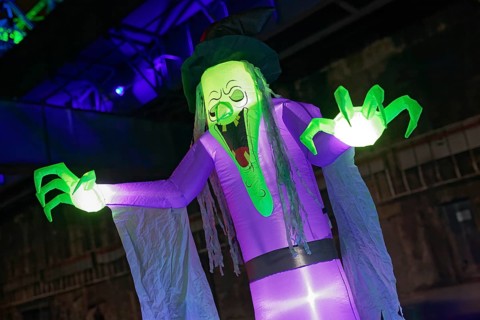 Illuminated scary figure at Halloween Run, night run in the Duisburg-Nord Landscape Park, Duisburg,