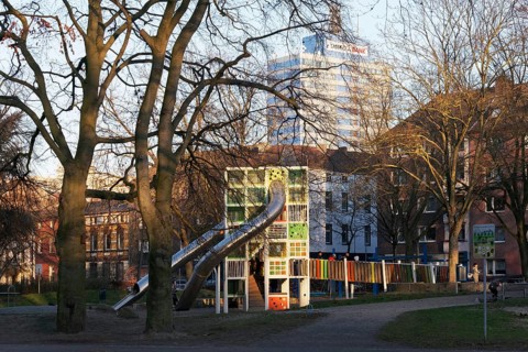 Children's playground with colorful climbing tower and slides, Immanuel-Kant-Park, Duisburg, North
