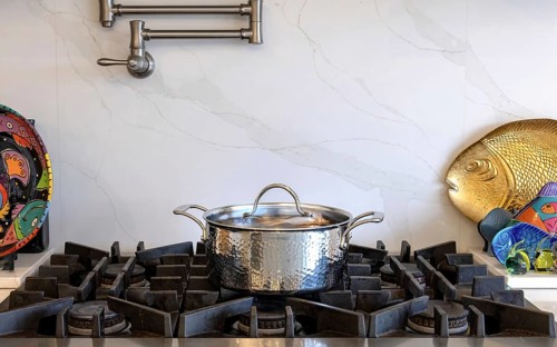 Modern kitchenware and microwave in luxury designer kitchen. Food preparation with expensive