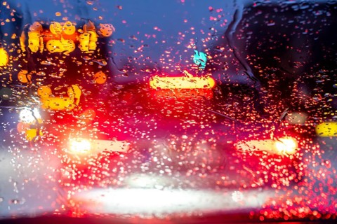 Driving in winter, in snow, rain, rear lights, brake lights