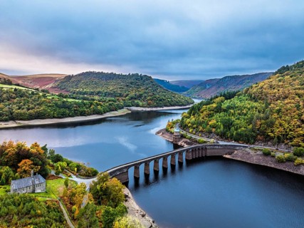 Autumn over Garreg Ddu Dam from a drone, Elan Valley, Caban-Coch Reservoir, Rhayader, Wales, UK