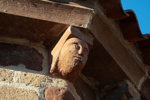 Azerat village. Sculpture of Roman church Saint-Jean-Baptiste . Haute Loire. Auvergne Rhone Alpes.