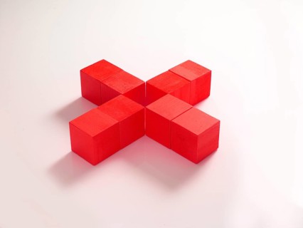 8 red wooden cubes against a white background