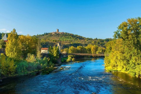 Suspension bridge of Coudes village on river Allier. Puy de Dome. Auvergne Rhone Alpes. France