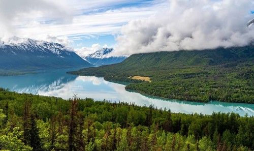 View of snowy mountains in spring and turquoise blue Kenai Lake, Slaughter Ridge Trail, Cooper
