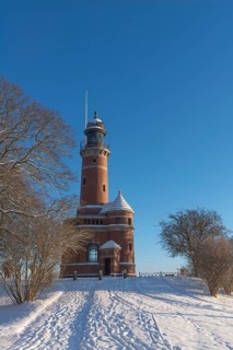 Holtenau lighthouse at the entrance of the Kiel Canal in winter, west bank of the Kiel Fjord,