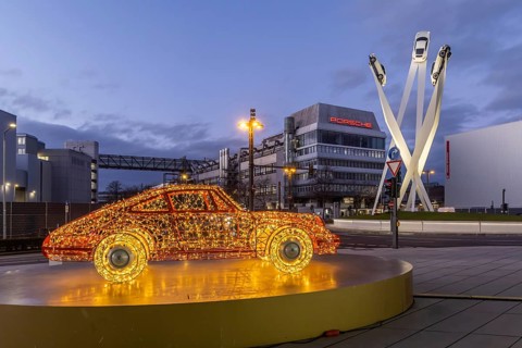 Highlights on Porscheplatz in Zuffenhausen. In front of the Porsche Museum and the car