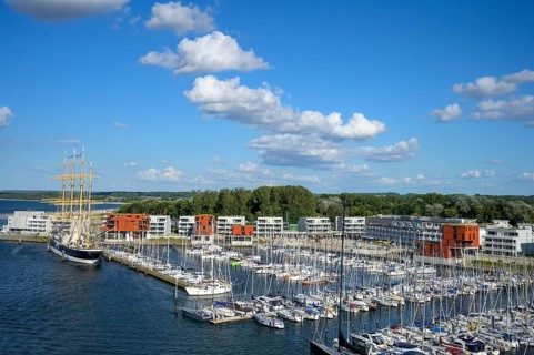 Harbour view with the legendary four-masted PASSAT barque and many boats in front of modern