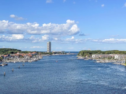 View over the Trave towards the mouth in the underground, the church of Travemünde and the Atlantic