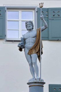 Fountain and Neptune with trident sculpture, Roman water god, Neptune fountain, market square,
