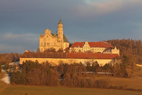 Benedictine monastery with late baroque monastery church, lighting atmosphere, winter, Neresheim,