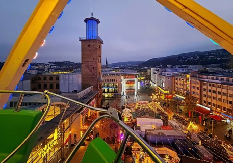 View of the town hall tower with the Christmas market from a Ferris wheel gondola, Hagen, Ruhr