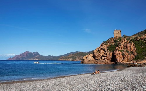 Genoese tower on the pebble beach of Porto, Ota, west coast of Corsica, Corse-du-Sud, Corsica,