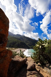 View of the pebble beach and Porto Bay, a UNESCO World Heritage Site, Ota, west coast of Corsica,