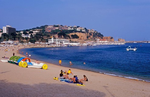 Houses, people, Sant Feliu de Guixols beach on the Costa Brava, Spain, June 1999, vintage, retro,