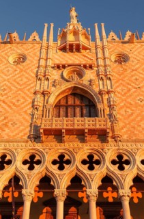 Sun rays at sunrise on the façade of the Doge's Palace, Venice, Veneto, Italy