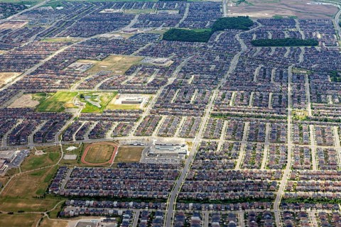 A densely built residential area with a clearly recognizable street pattern seen from the air, view